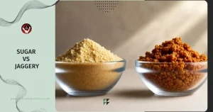 Jaggery vs Sugar – featured image showing white refined sugar on the left and brown jaggery on the right in clear glass bowls against a clean background, with the bold title 'Sugar vs Jaggery' displayed prominently.